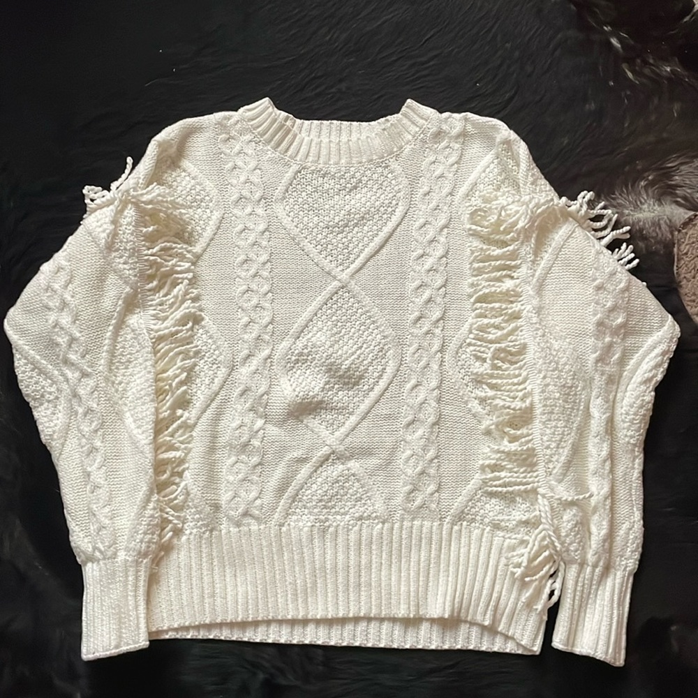 White knitted sweater with fringe